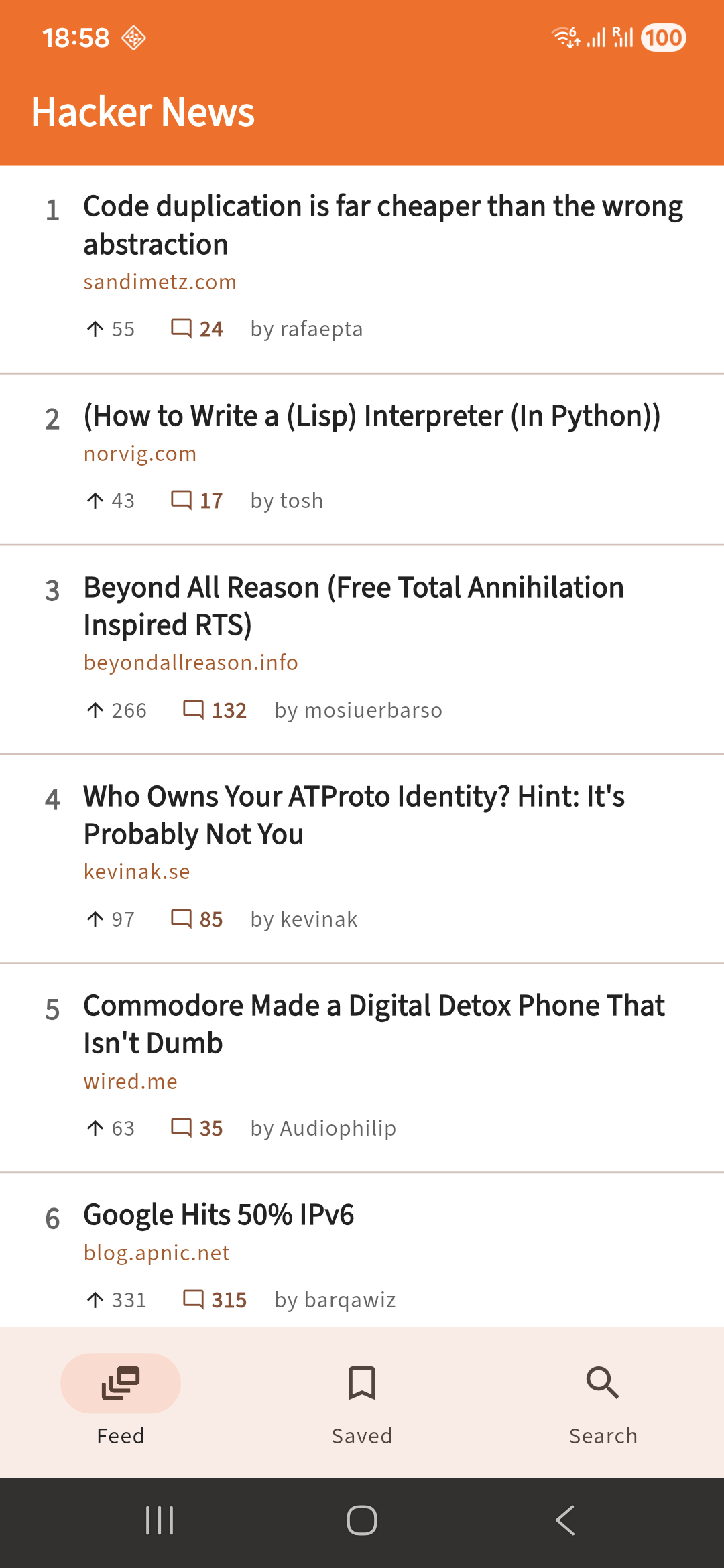 The story feed, a list of Hacker News top stories with domain and comment-count chips